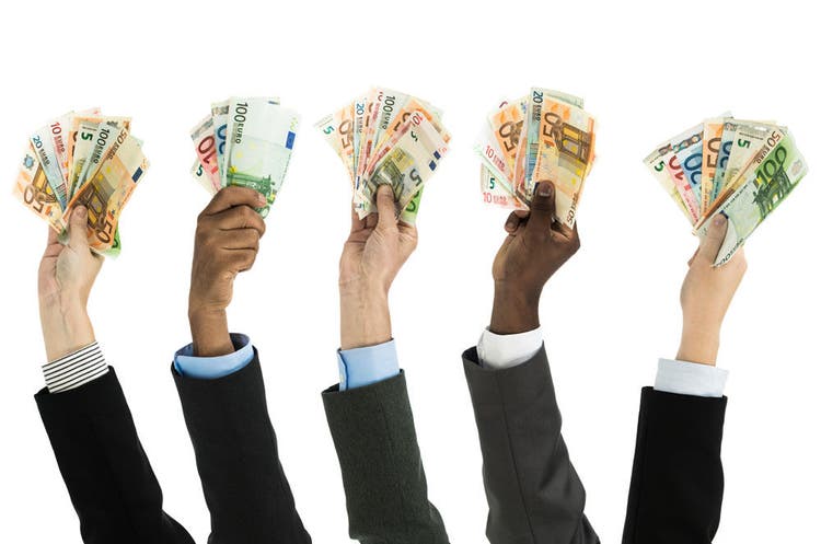 Business people holding euro currency