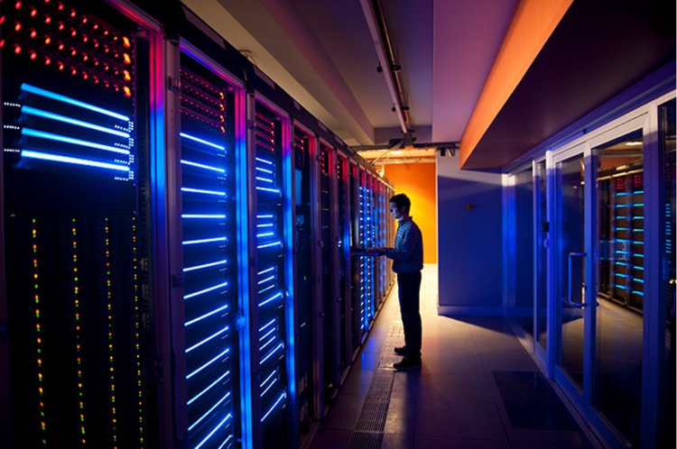 IT Engineer in Action Configuring Servers. Modern interior of server room in datacenter. IT Engineer in Action Configuring Servers